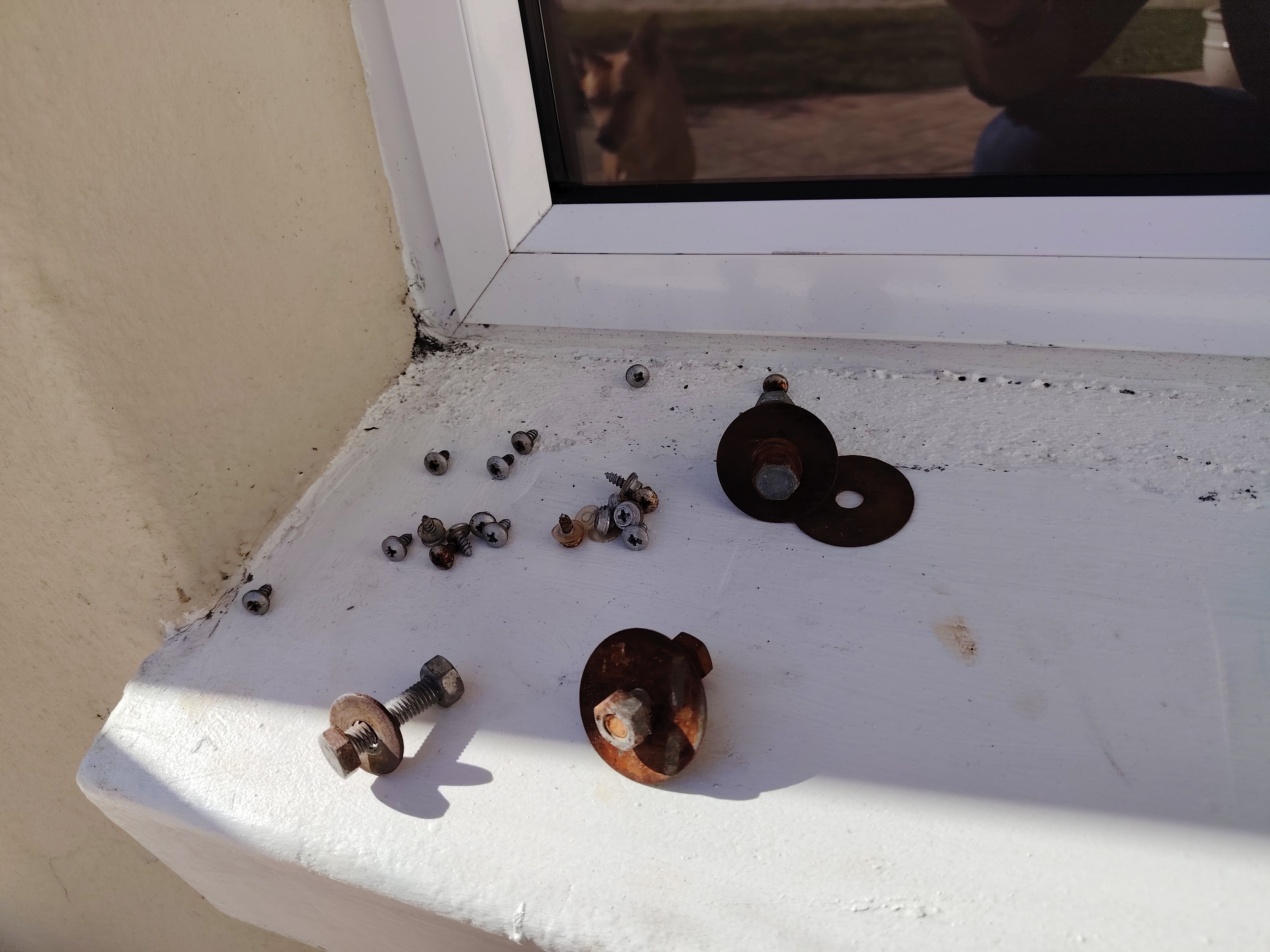Rusted nuts and bolts removed and replaced on an outdoor air conditioning unit
